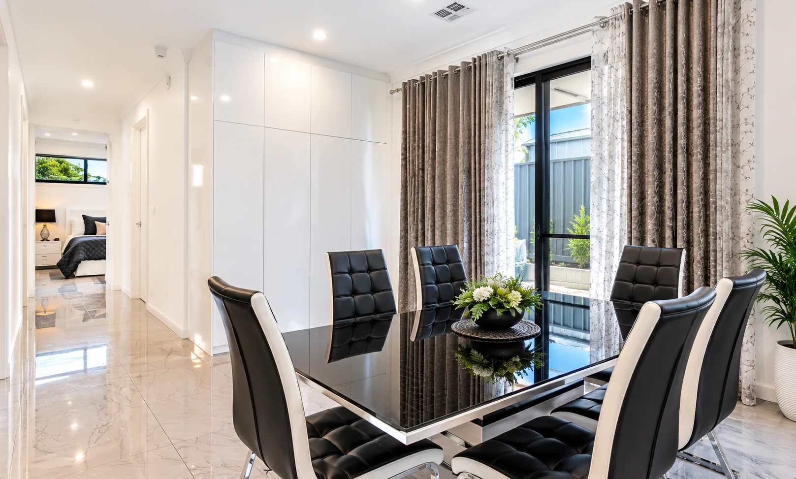 Dining area with a long timber table and contemporary interior finishes